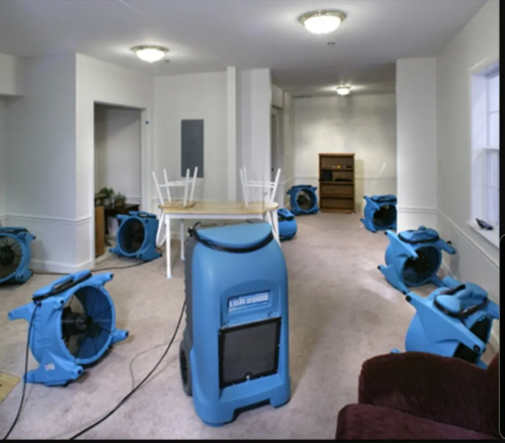 Air movers and dehumidifier setup for Water Damage Restoration in Epsom